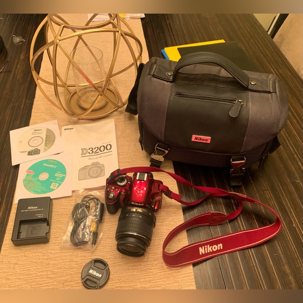 Nikon D3200 camera with case, cables, and instructional booklet/DVD's